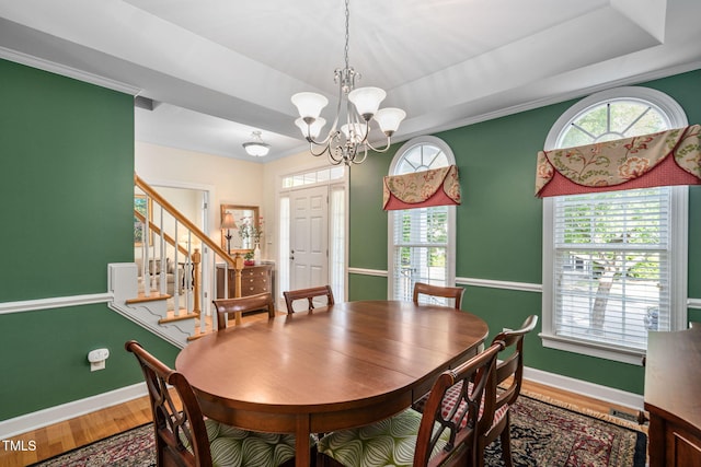 210 Presidents Walk Ln, Cary, NC 27519 - dining space with baseboards, a raised ceiling, wood finished floors, and a chandelier