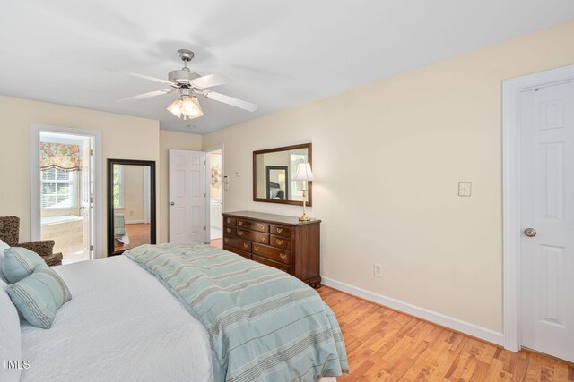210 Presidents Walk Ln, Cary, NC 27519 - bedroom featuring baseboards, ensuite bathroom, a ceiling fan, and light wood finished floors
