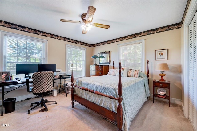 206 Kittys Ln, Erwin, NC 28339 - carpeted bedroom with baseboards, ceiling fan, and a closet