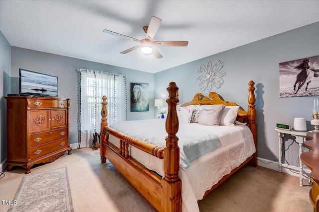 206 Kittys Ln, Erwin, NC 28339 - bedroom featuring baseboards, a ceiling fan, and light colored carpet