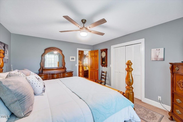 206 Kittys Ln, Erwin, NC 28339 - bedroom with a ceiling fan, baseboards, light carpet, and a closet
