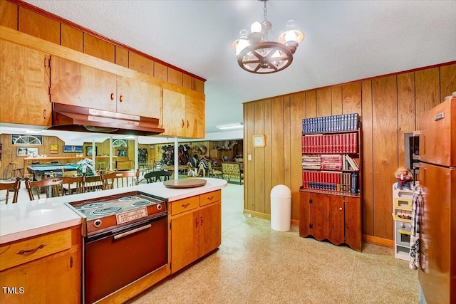 206 Kittys Ln, Erwin, NC 28339 - kitchen with under cabinet range hood, light countertops, a chandelier, and electric stove