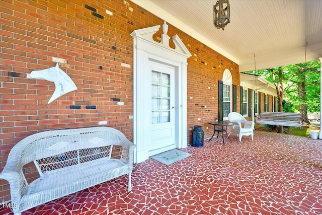 206 Kittys Ln, Erwin, NC 28339 - property entrance with a porch and brick siding