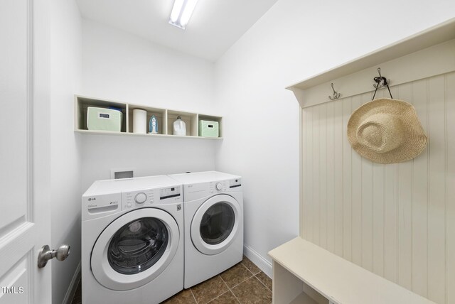 20 Paddy Ln, Youngsville, NC 27596 - washroom with washing machine and dryer and baseboards