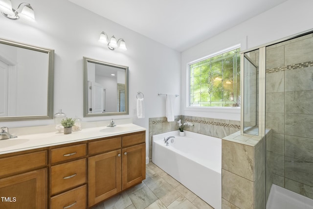 20 Paddy Ln, Youngsville, NC 27596 - full bath with a bath, a shower stall, double vanity, and marble look tiles