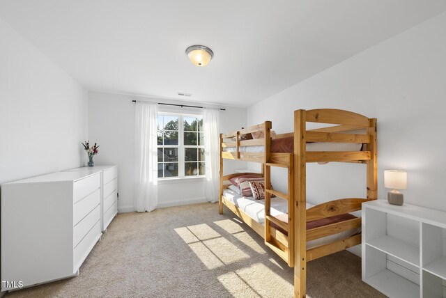 20 Paddy Ln, Youngsville, NC 27596 - bedroom featuring light colored carpet and baseboards