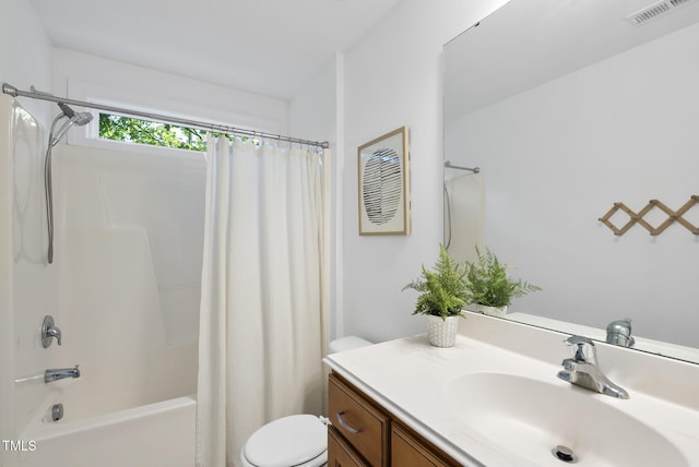 20 Paddy Ln, Youngsville, NC 27596 - bathroom featuring toilet, shower / bath combination with curtain, and vanity