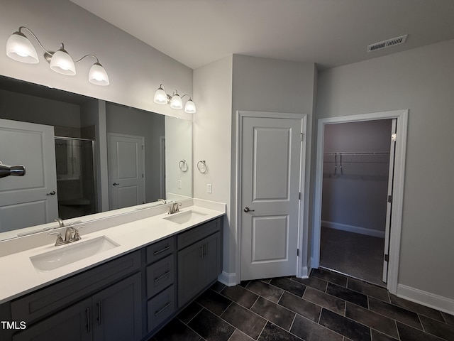 5084 Holly Hill Ct Lot 25, Battleboro, NC 27809 - bathroom with visible vents, a sink, double vanity, and a shower stall