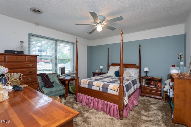 bedroom with dark carpet, a textured ceiling, ceiling fan, and visible vents