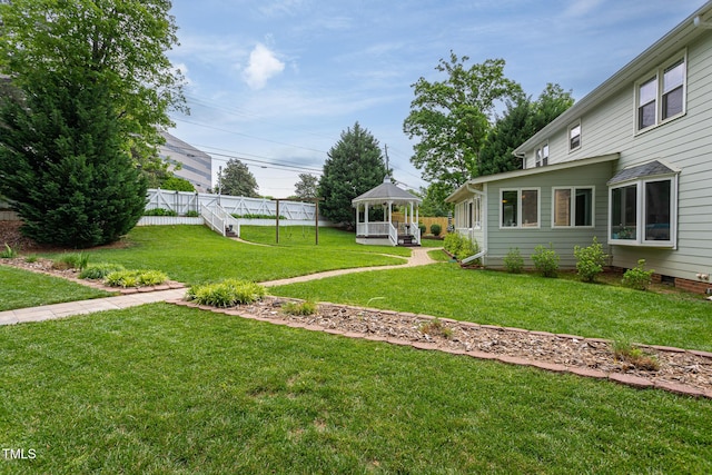 view of yard with a gazebo and fence