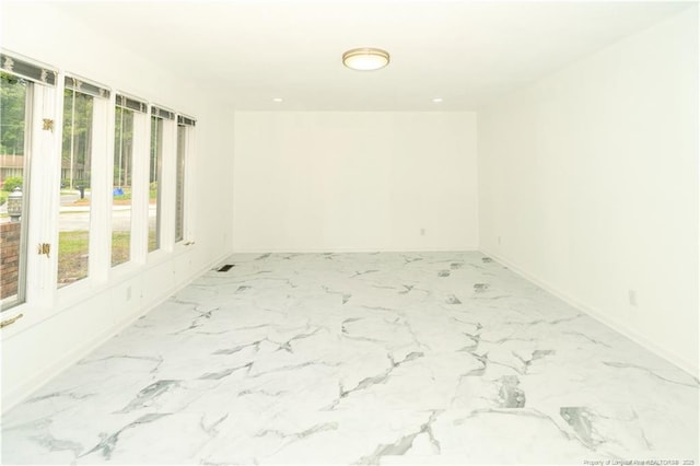 2513 Colgate Dr, Fayetteville, NC 28304 - empty room with plenty of natural light, baseboards, and light marble finish floors
