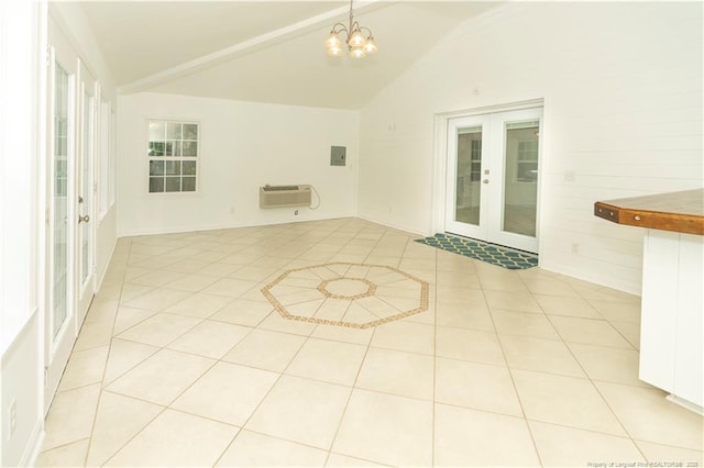 2513 Colgate Dr, Fayetteville, NC 28304 - empty room with french doors, lofted ceiling, a chandelier, an AC wall unit, and light tile patterned flooring