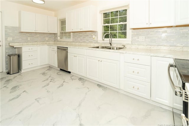2513 Colgate Dr, Fayetteville, NC 28304 - kitchen featuring a sink, stainless steel dishwasher, range, white cabinetry, and decorative backsplash