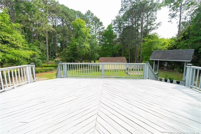 2513 Colgate Dr, Fayetteville, NC 28304 - wooden deck featuring an outdoor structure and a storage shed