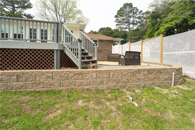 2513 Colgate Dr, Fayetteville, NC 28304 - rear view of house featuring fence, a wooden deck, and stairs