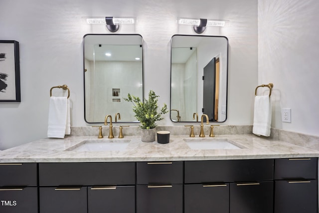 full bathroom with a sink and double vanity
