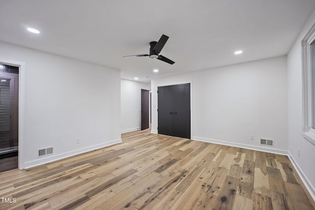 interior space featuring recessed lighting, light wood-type flooring, and visible vents