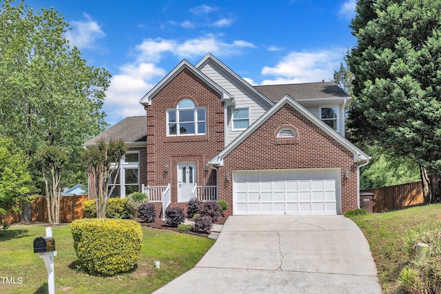 traditional-style house featuring fence, concrete driveway, a front lawn, and brick siding