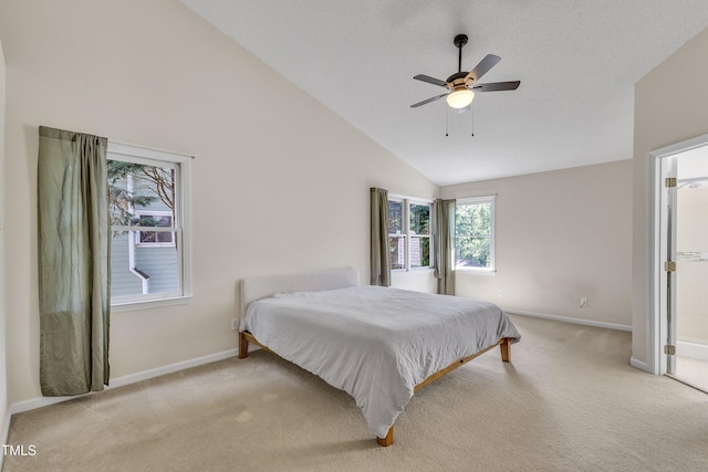 bedroom featuring baseboards, ceiling fan, lofted ceiling, and light carpet