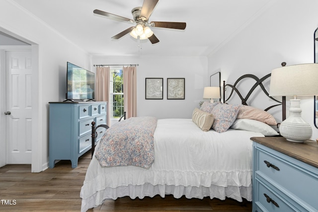 bedroom with ornamental molding, ceiling fan, and wood finished floors