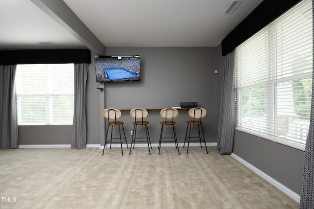 dining room with visible vents, carpet, and baseboards