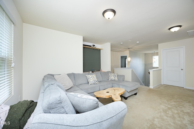 living room featuring carpet floors and visible vents