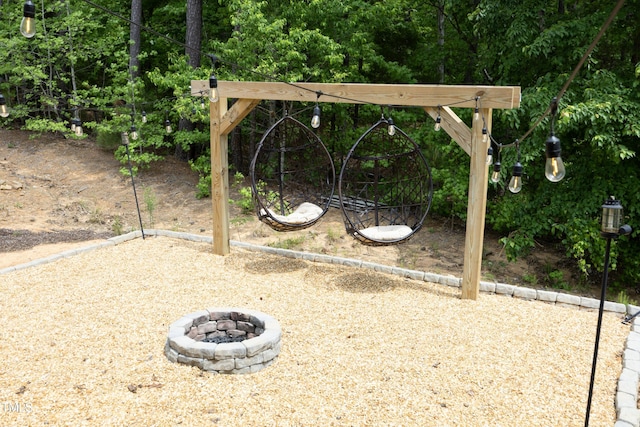 view of yard featuring an outdoor fire pit