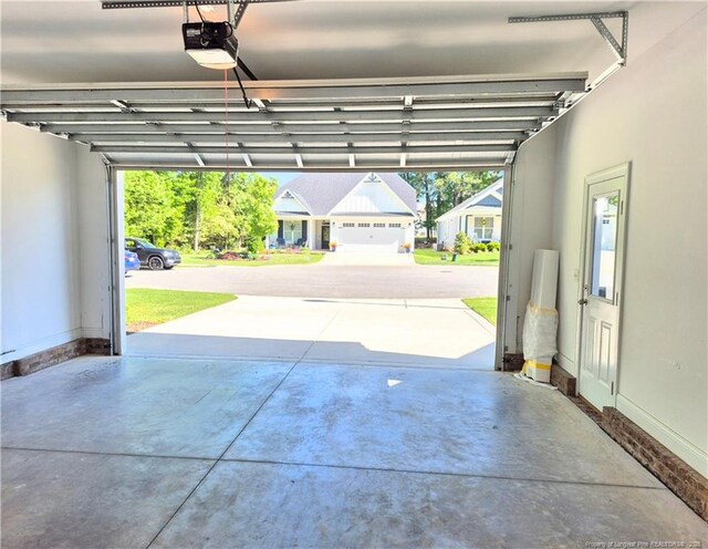garage featuring baseboards and a garage door opener