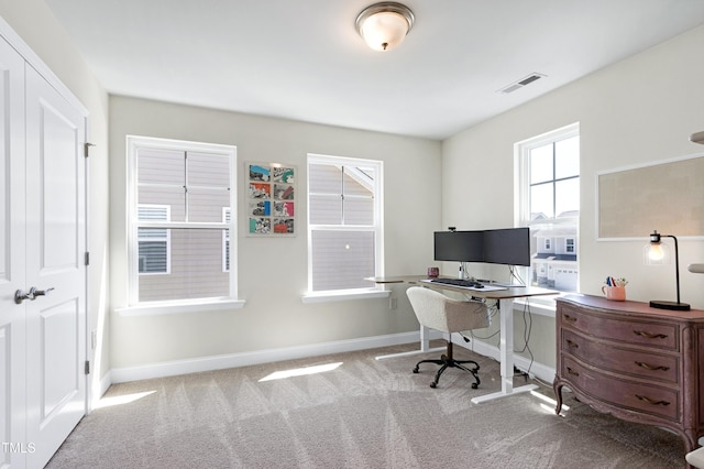 office area with visible vents, baseboards, and carpet floors