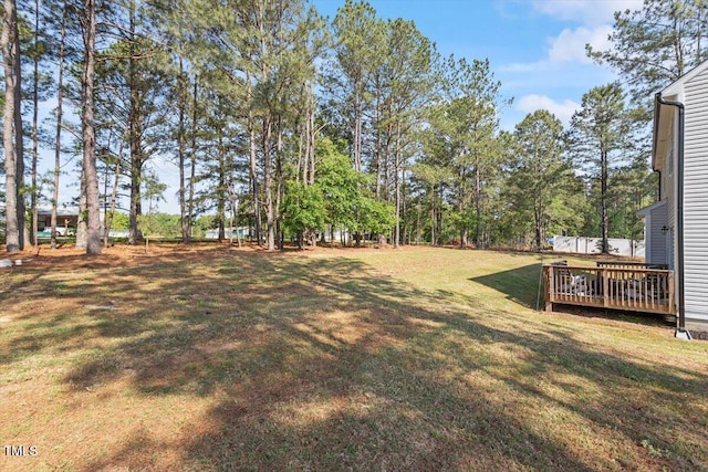 7729 Calcutta Dr, Willow Springs, NC 27592 - view of yard with a wooden deck