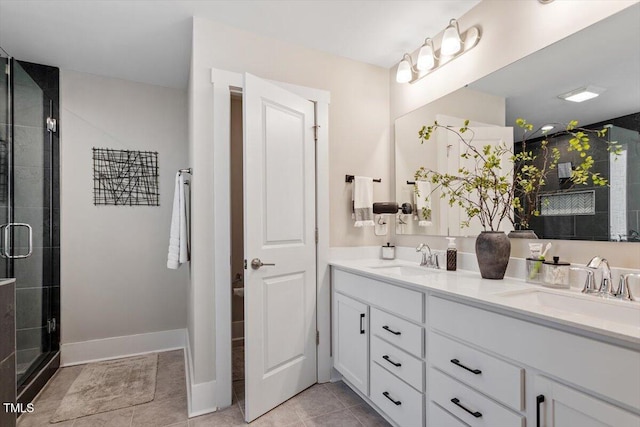 7729 Calcutta Dr, Willow Springs, NC 27592 - bathroom with double vanity, tile patterned floors, a sink, and a stall shower