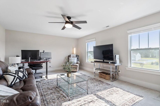 7729 Calcutta Dr, Willow Springs, NC 27592 - living room with carpet floors, a ceiling fan, and visible vents