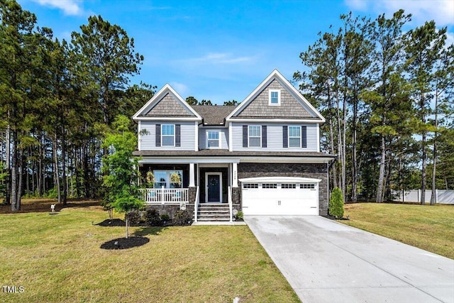 7729 Calcutta Dr, Willow Springs, NC 27592 - craftsman inspired home featuring a front lawn, stone siding, a garage, concrete driveway, and covered porch
