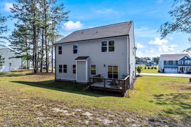 7729 Calcutta Dr, Willow Springs, NC 27592 - back of house featuring a yard and a deck