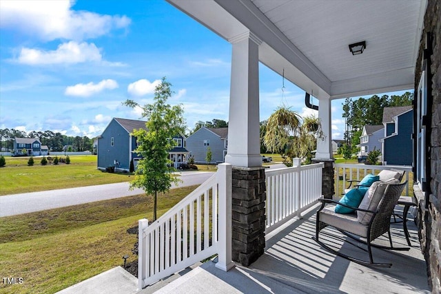 7729 Calcutta Dr, Willow Springs, NC 27592 - view of patio / terrace featuring covered porch and a residential view