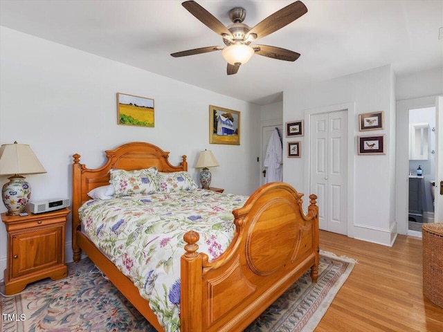 bedroom with light wood finished floors and ceiling fan