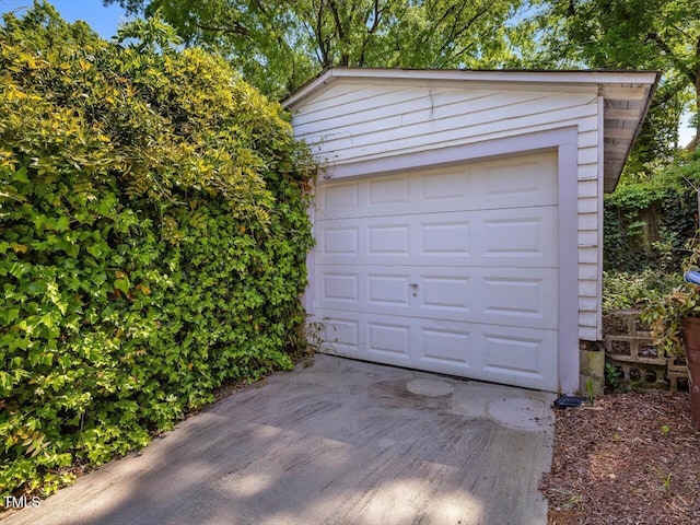 detached garage featuring driveway