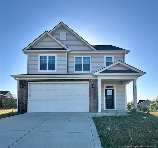 331 Brentmoor Dr, Raeford, NC 28376 - traditional home with an attached garage, driveway, and brick siding