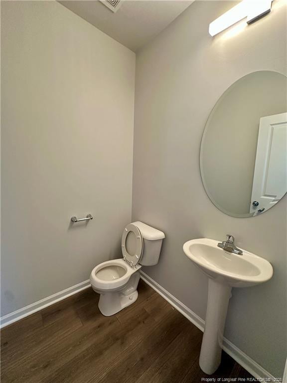331 Brentmoor Dr, Raeford, NC 28376 - half bath with baseboards, toilet, and wood finished floors