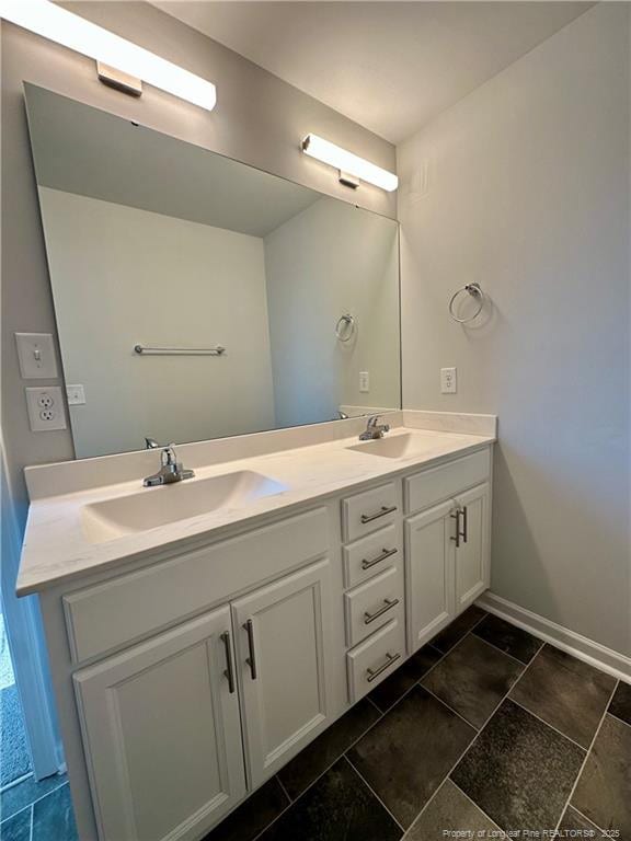 331 Brentmoor Dr, Raeford, NC 28376 - bathroom with a sink, baseboards, and double vanity