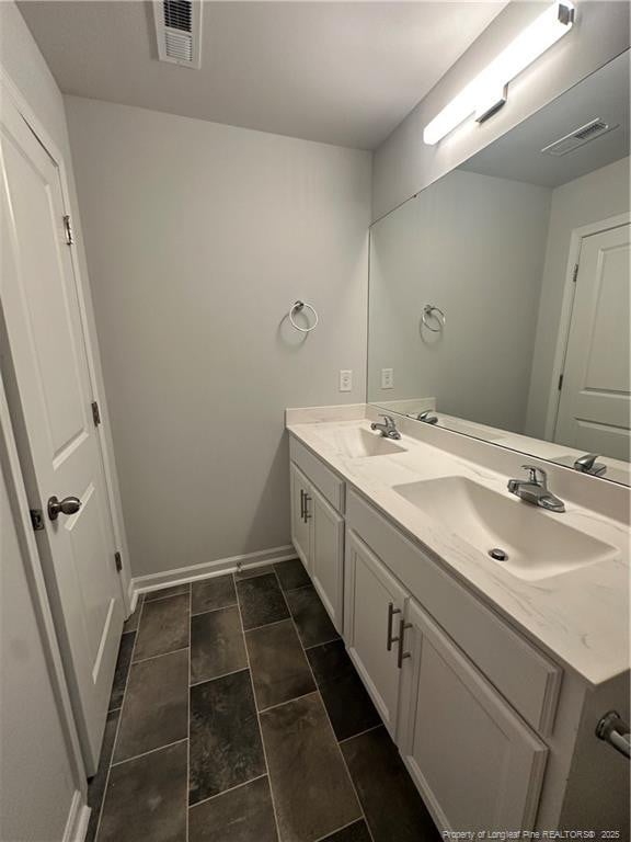 331 Brentmoor Dr, Raeford, NC 28376 - full bathroom featuring double vanity, visible vents, and a sink