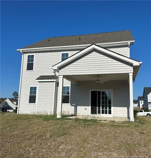 331 Brentmoor Dr, Raeford, NC 28376 - back of house with a ceiling fan, a yard, and a shingled roof