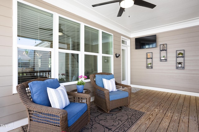 wooden deck with ceiling fan and a porch
