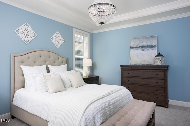 carpeted bedroom featuring crown molding, baseboards, and a notable chandelier