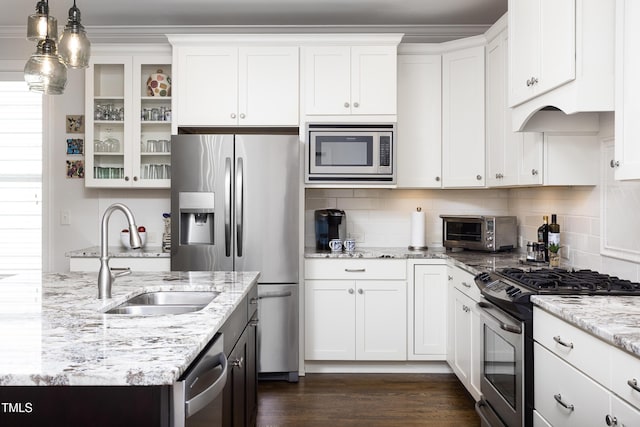 kitchen featuring a sink, white cabinetry, appliances with stainless steel finishes, and a toaster