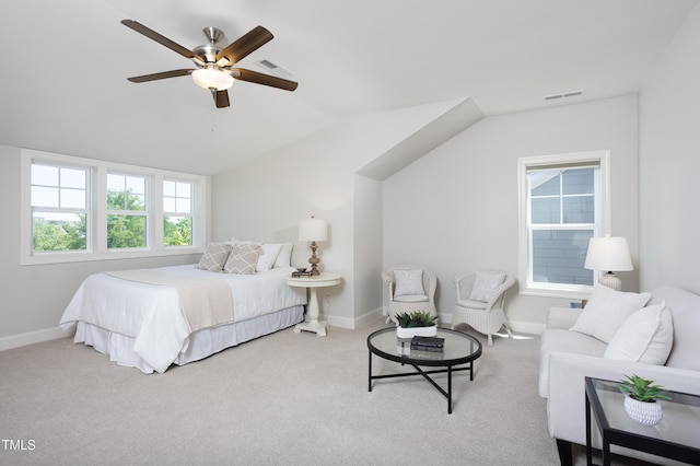 bedroom with visible vents, baseboards, carpet floors, and vaulted ceiling