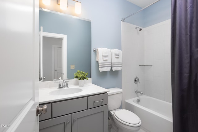 bathroom with vanity, toilet, and shower / tub combo