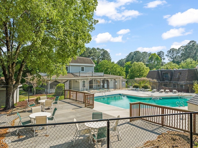 pool featuring a patio and fence