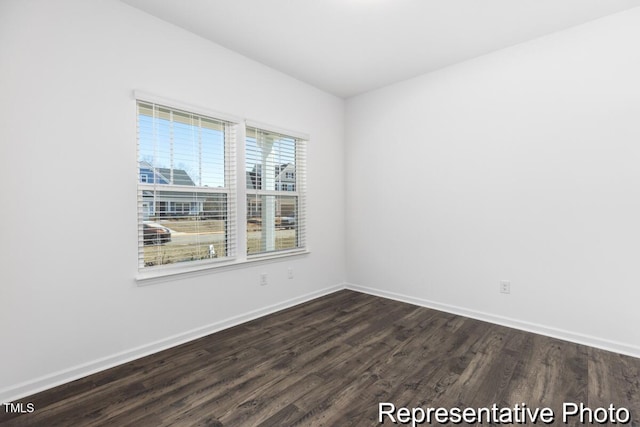 517 W Brocklyn St Unit 63P, Benson, NC 27504 - unfurnished room featuring baseboards and dark wood finished floors