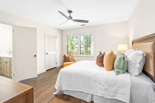 bedroom with a ceiling fan, visible vents, wood finished floors, baseboards, and a closet